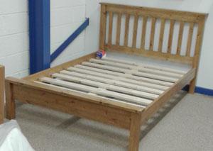 pine slatted bed, with lowered end